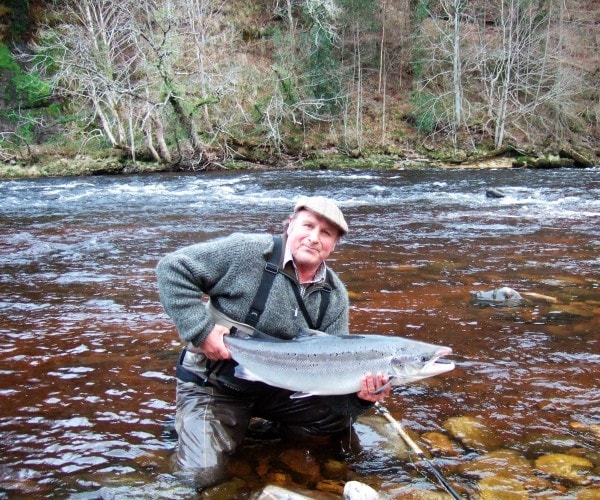 Releasing a superb salmon back into the river