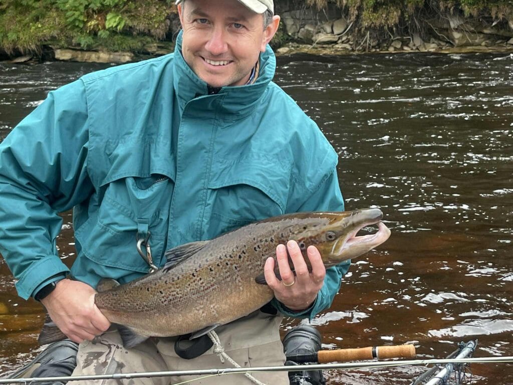 Matt Gill looking delighted with his first ever Atlantic salmon from Roan pool at Altyre Estate