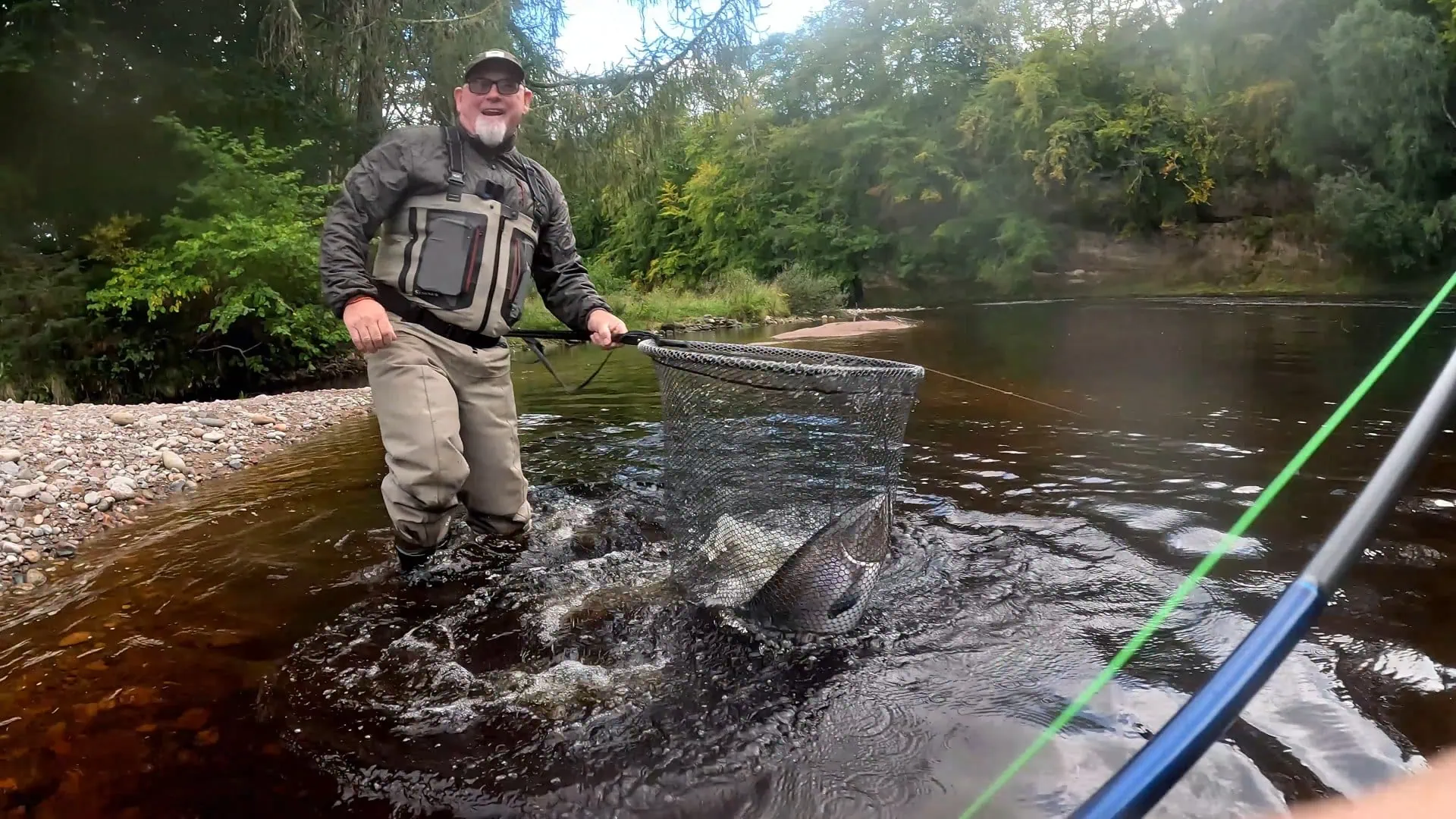 Double-figure summer salmon safely in the net at Roehillock pool, Altyre Estate - guided fishing with The Speycaster
