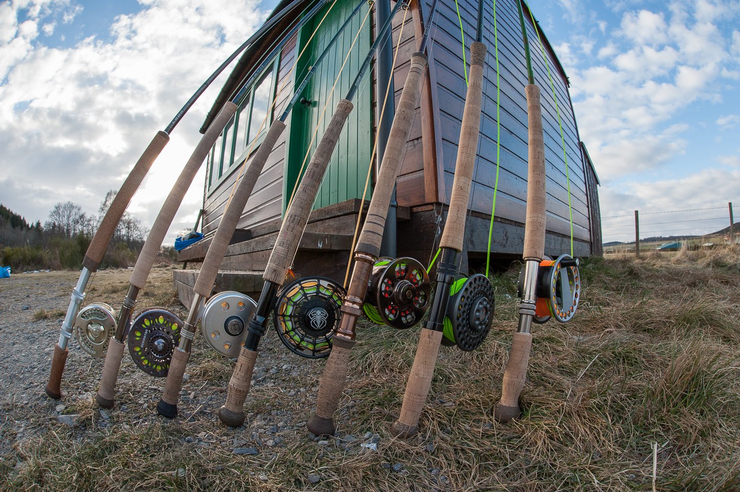 Spey rods and salmon reels lined up ready for tackle hire guests